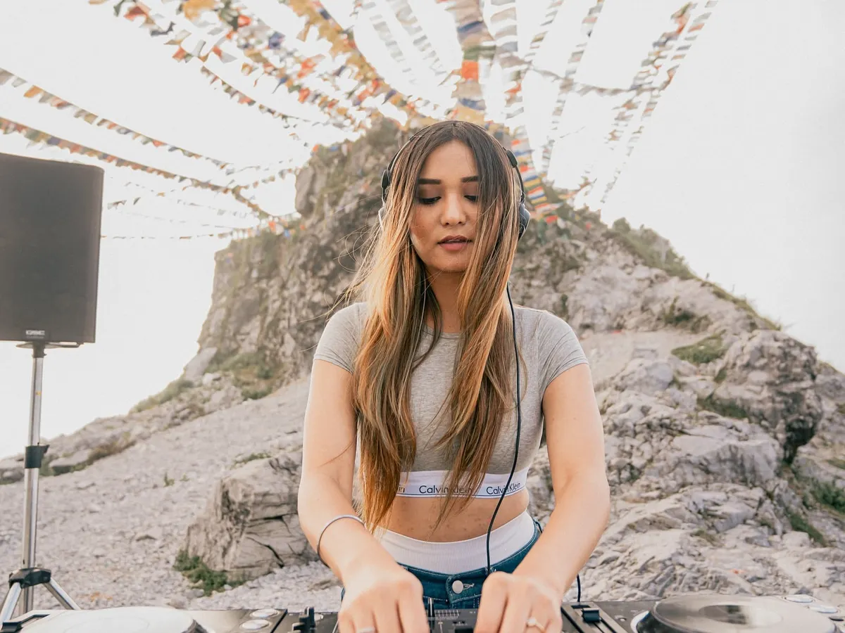 DJing with a view. This was a special set, playing techno surrounded by the mountains and prayer flags. It shows that a great party can happen anywhere, from a dark club to an open-air festival.