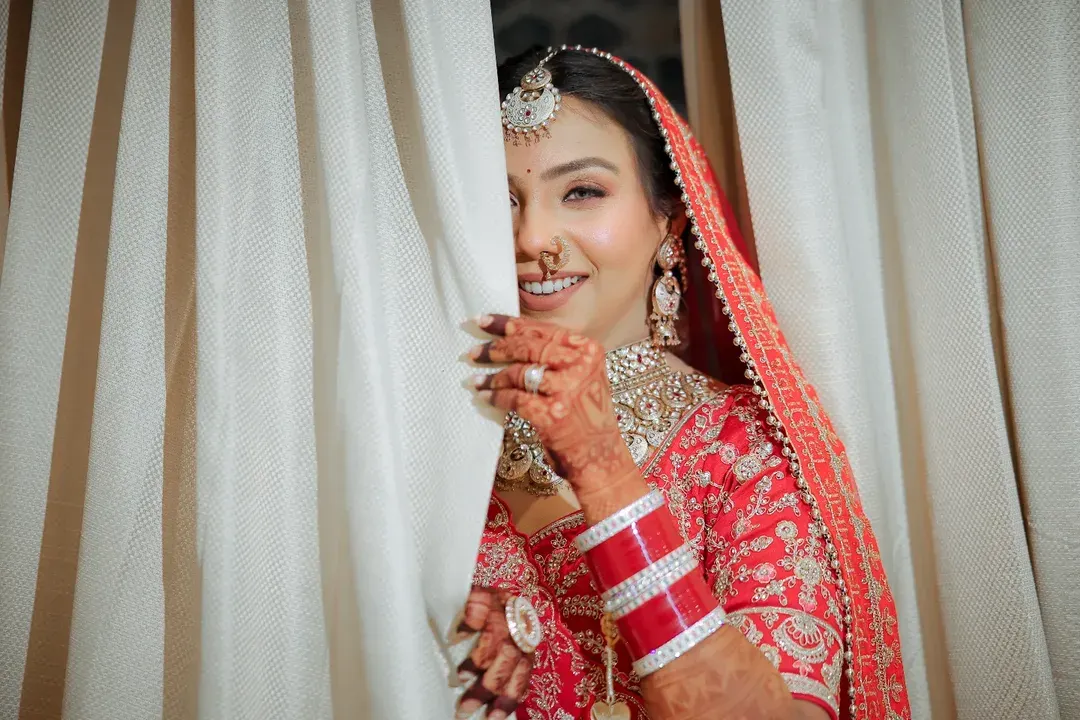 There's a special kind of magic in the moments just before you walk down the aisle. I love capturing that playful anticipation, the beautiful smile of a bride ready to meet her forever. This shot, with the soft light and genuine joy, is a perfect example of a timeless bridal portrait.