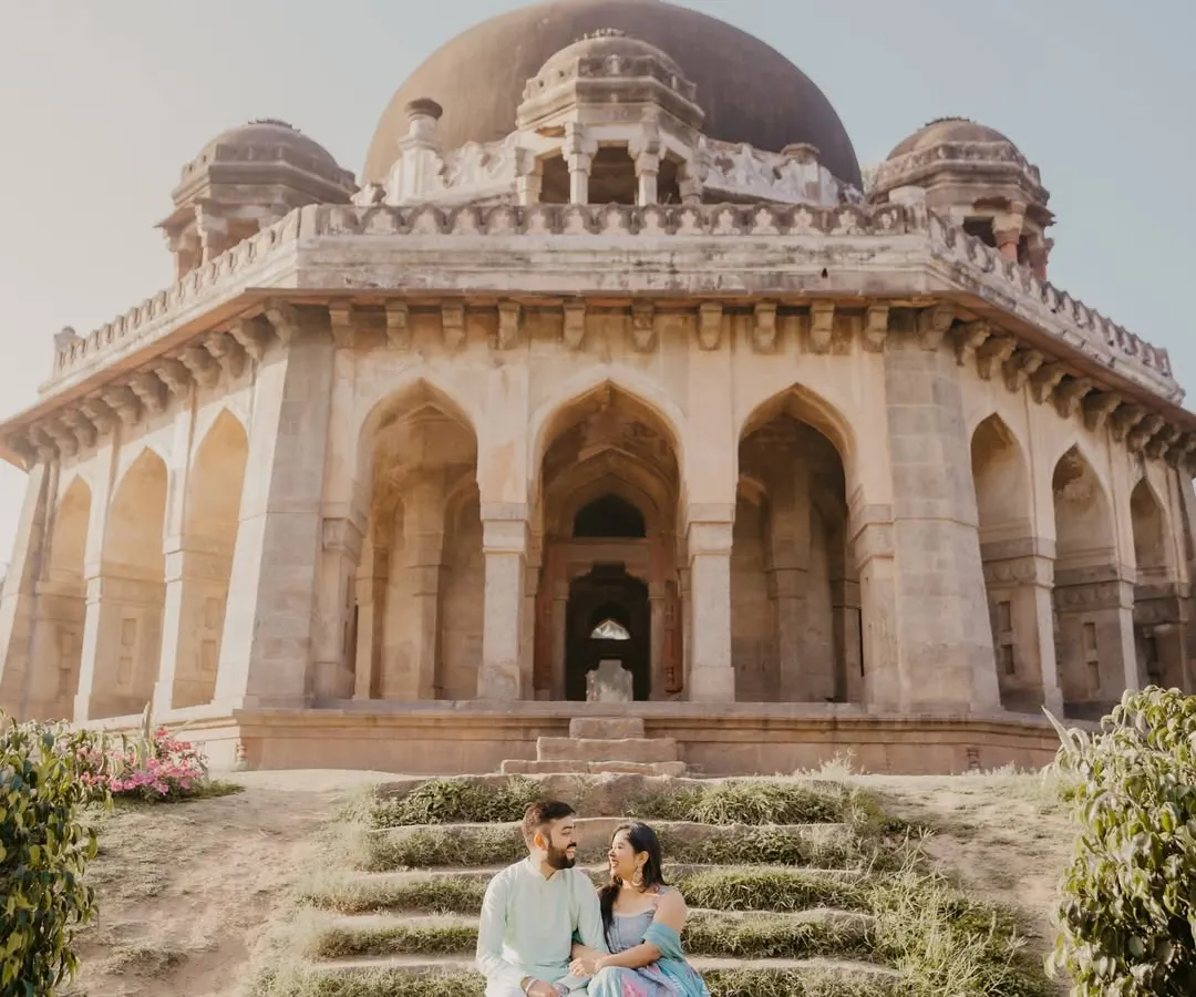 Set against the timeless architecture of Delhi's monuments, this shot captures a quiet moment of connection. I love using these historic locations for a classic and regal pre-wedding photoshoot.