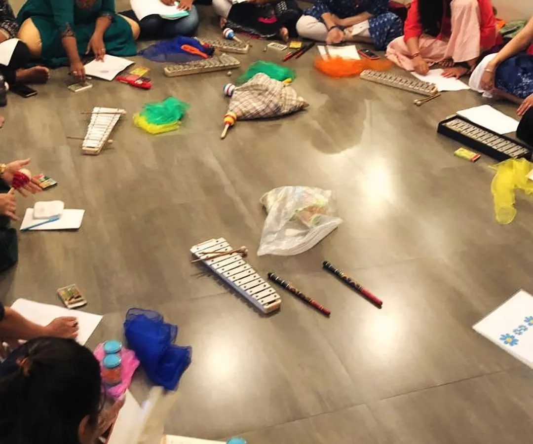 This is what our teacher training looks like: a collaborative, hands-on session where educators learn to design their own play-based music curriculum. Here, our trainees are working together on lesson plans, surrounded by instruments and creative materials.