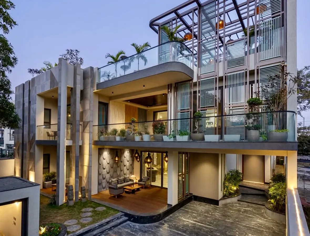 I believe landscaping should complement the architecture. For this modern villa in Faridabad, I used a mix of potted plants on multiple balcony levels and a curated ground-floor garden to soften the building's strong lines and integrate it with its natural surroundings.