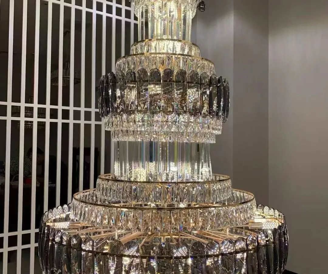 For spaces that demand pure opulence, I offer grand crystal chandeliers like this multi-tiered masterpiece. This is a modern take on the classic jhumar, designed to create a breathtaking cascade of light in a double-height foyer or a luxurious ballroom.