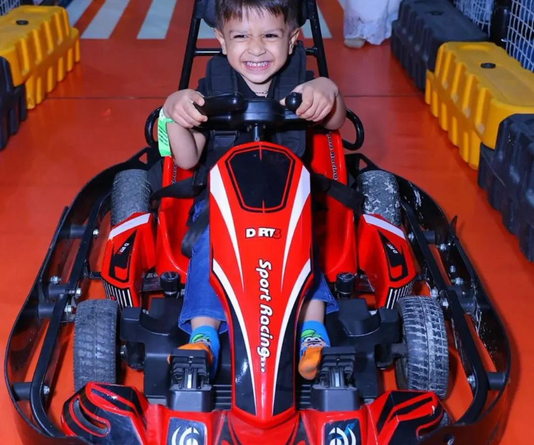 We love seeing the pure joy on our young racers' faces! Our kid-friendly electric go-karts offer a thrilling yet completely safe indoor racing experience on a dedicated track.