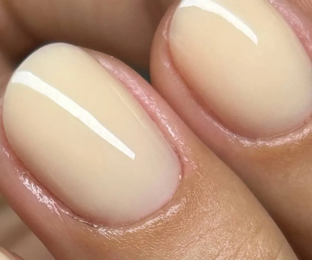 The perfect Russian Manicure. Notice the incredibly clean cuticle line and the smooth, flawless application of this jelly nude gel polish. This meticulous technique ensures your manicure not only looks perfect but also lasts longer.