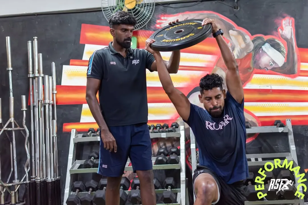 I work closely with elite athletes like Roy Krishna, Fiji's captain and an ISL legend, to ensure they return to sport stronger than before. Here, I am guiding him through a targeted strength exercise, focusing on precise form to build power and prevent re-injury. This level of personalized coaching is central to my approach for every athlete.