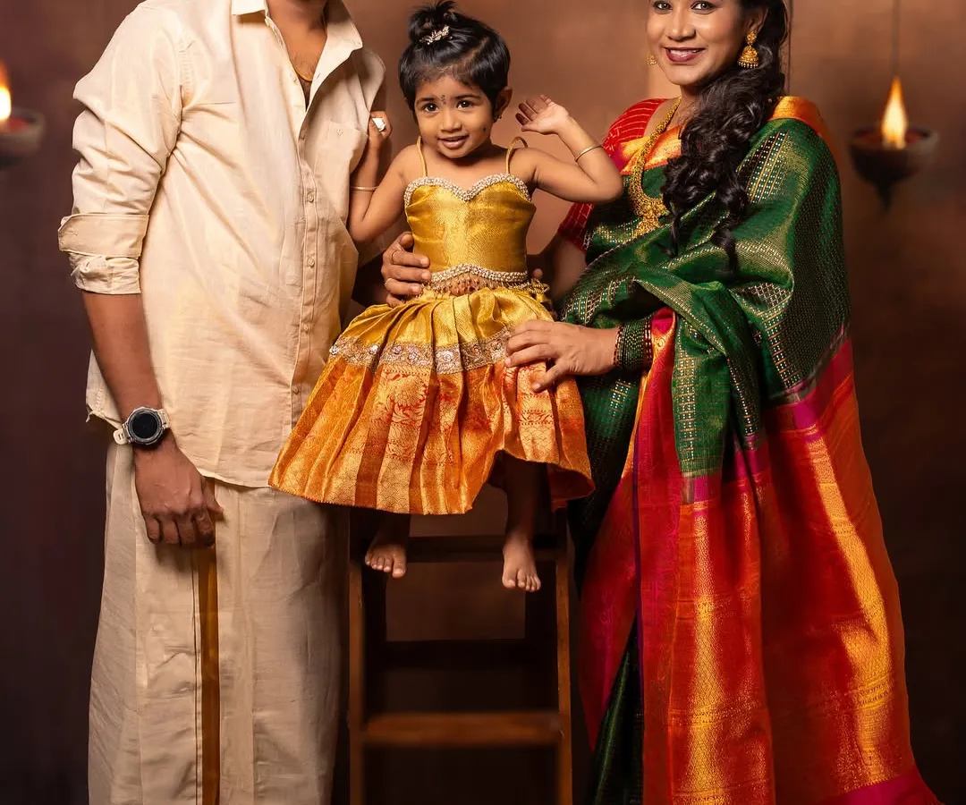 Celebrating heritage is a beautiful part of any family's story. In my studio, I created a classic, traditional setting for this family's maternity portrait, complete with rich silk attire and a warm, timeless backdrop. This is a portrait that will be treasured for generations.