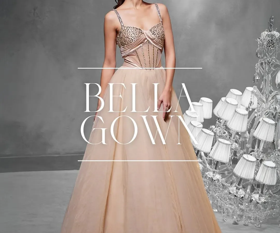 The Bella Gown combines timeless elegance with my signature corsetry. I crafted this piece with a hand-embellished bodice that flows into a delicate tulle A-line skirt, creating a silhouette that is both classic and modern.