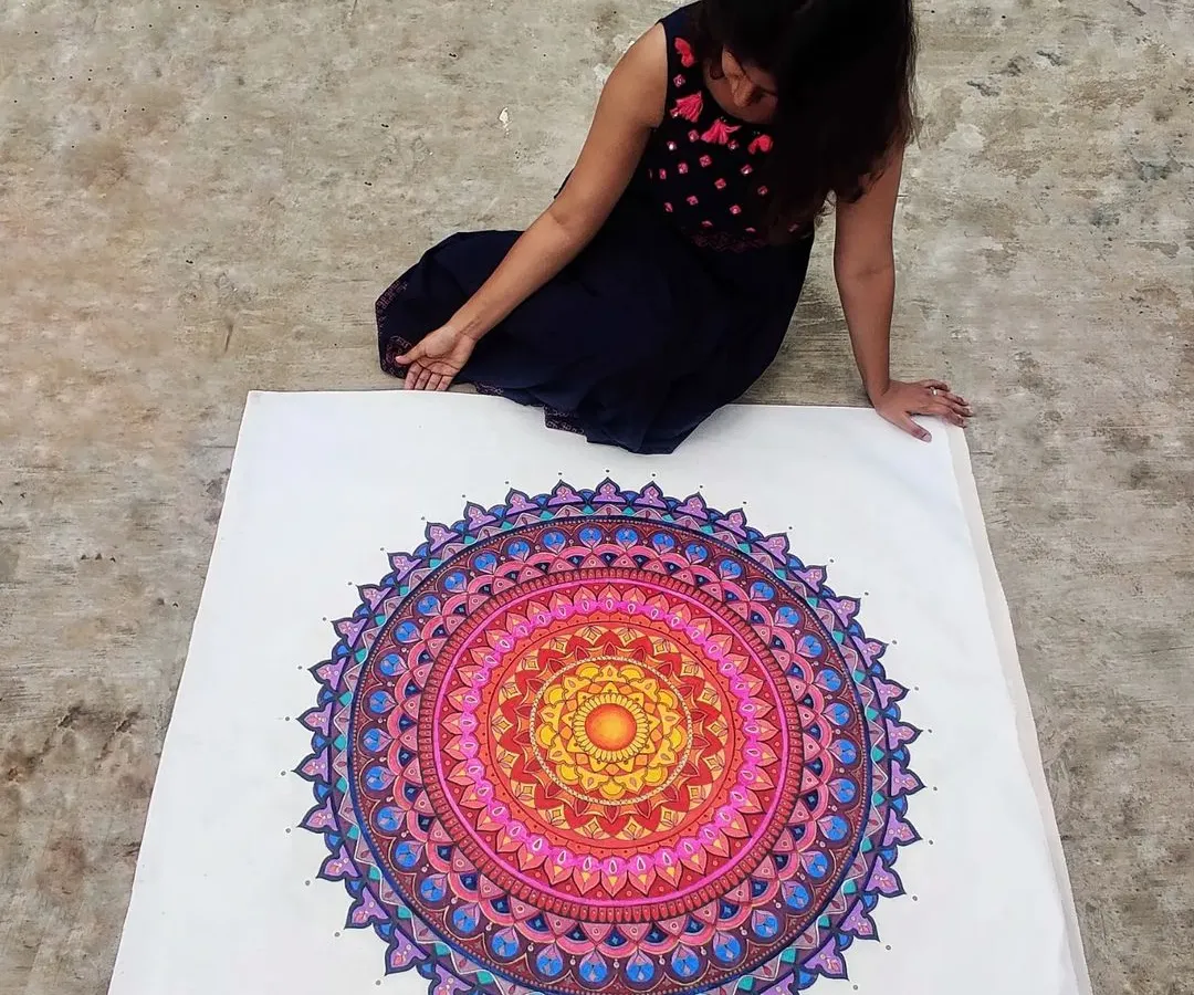 Here I am with a huge, custom-painted mandala on canvas. I love working on a large scale to create a truly immersive piece of art that becomes the centerpiece of any room.