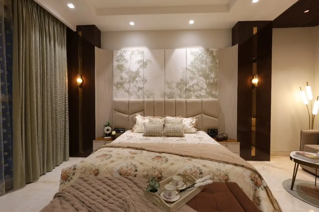 For this master bedroom in Delhi, the goal was timeless tranquility. I used a soft, neutral palette, a custom upholstered headboard with nature-inspired panels, and layered lighting to craft a warm, refined sanctuary that feels like a lasting comfort.