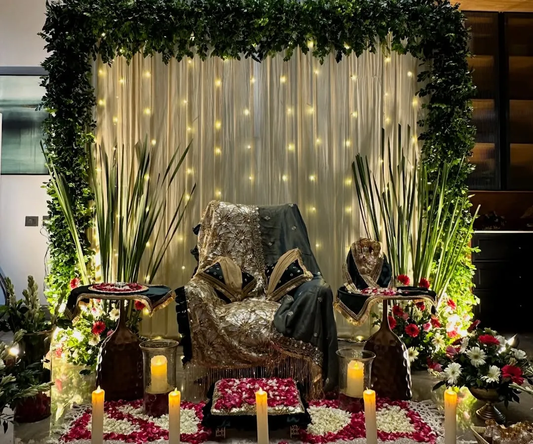 We create serene and beautiful setups for Guru Ji satsangs. This particular design features a lush green floral frame, a backdrop of soft fairy lights, and carefully arranged rose petals on the floor, creating a peaceful and blessed atmosphere for prayer and meditation.