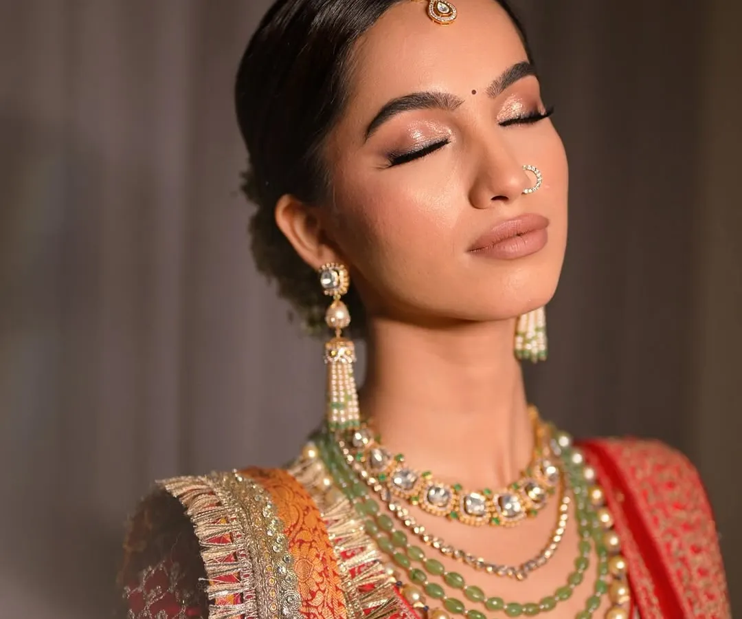 A close-up of a modern bridal makeup look. I used soft, warm brown tones on the eyes with a shimmer finish, complemented by a clean winged liner to create an elegant and timeless feel perfect for a wedding ceremony.