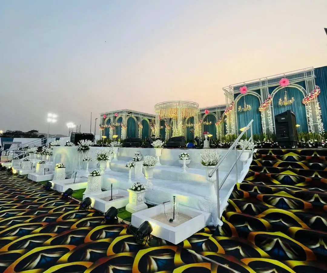 A breathtaking view of a grand reception stage I designed. Notice the multi-level platform, integrated water features, and the striking custom carpet that all come together to create an unforgettable backdrop for a special day.