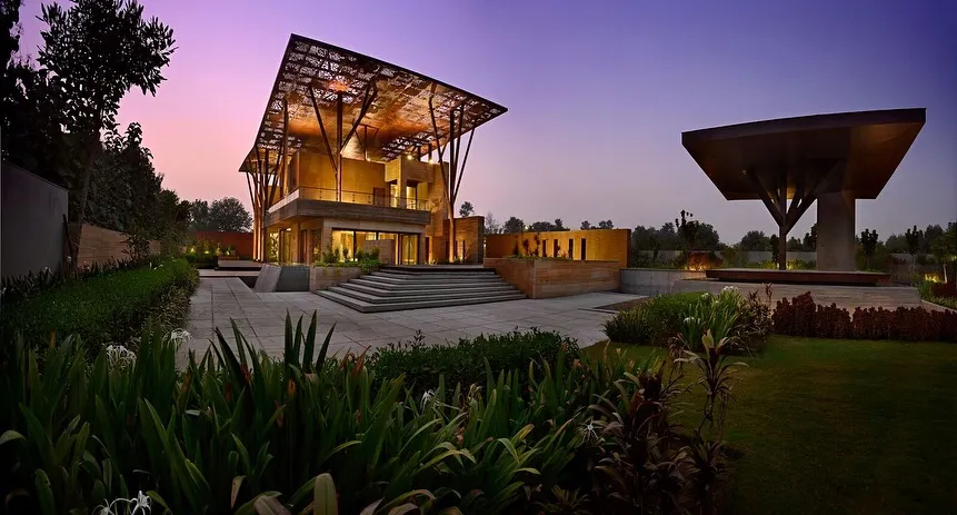 The Tree House project in Delhi reimagines shelter with a sculptural, perforated metal canopy supported by branching columns. This award-winning design creates a dynamic play of light and shadow, demonstrating how modern architecture can be both innovative and deeply inspired by the protective forms of nature.