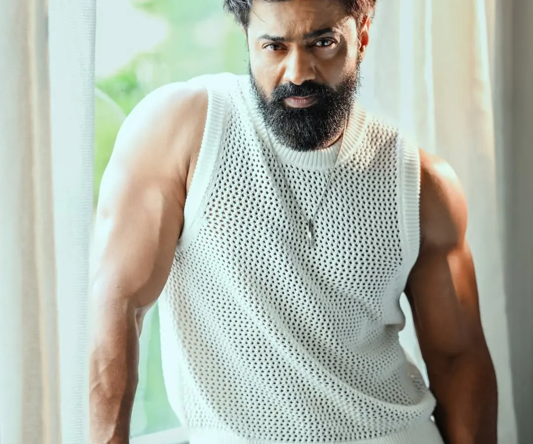 A powerful portrait of actor Dev Adhikari. I used natural window light to create strong highlights and shadows, emphasizing a rugged and contemplative mood. This style is ideal for creating impactful celebrity portfolios.