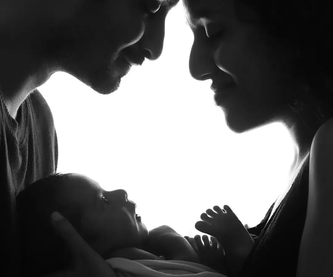 This is what it's all about. The beginning of a new family story, captured in a simple, loving silhouette. These quiet moments are just everything.