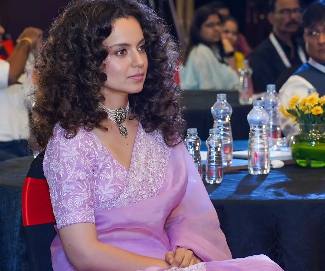 A candid photograph of actress Kangana Ranaut in the audience. I specialize in discreetly capturing high-profile guests and VIPs, ensuring authentic moments are preserved without disrupting the event flow.