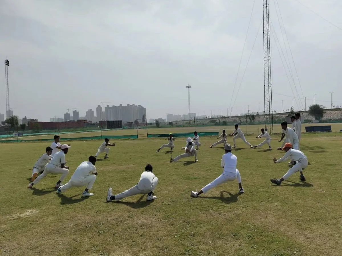 Our warm-ups are not just about running. We focus on dynamic stretching and mobility exercises like these side lunges to prepare your muscles for explosive cricketing movements and reduce injury risk.