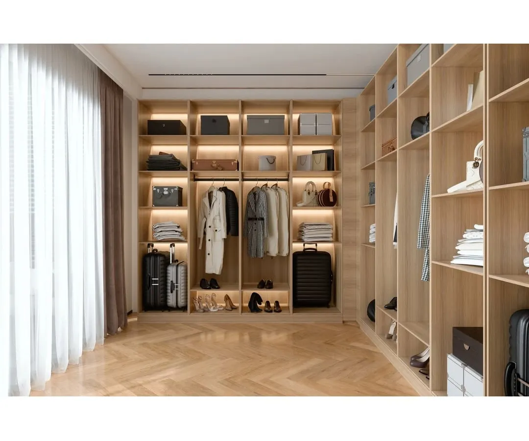 A well-organized space is the ultimate luxury. This custom walk-in wardrobe showcases our approach to smart storage, featuring natural wood finishes, integrated LED lighting to illuminate your collection, and ample shelving for clothing, accessories, and luggage.