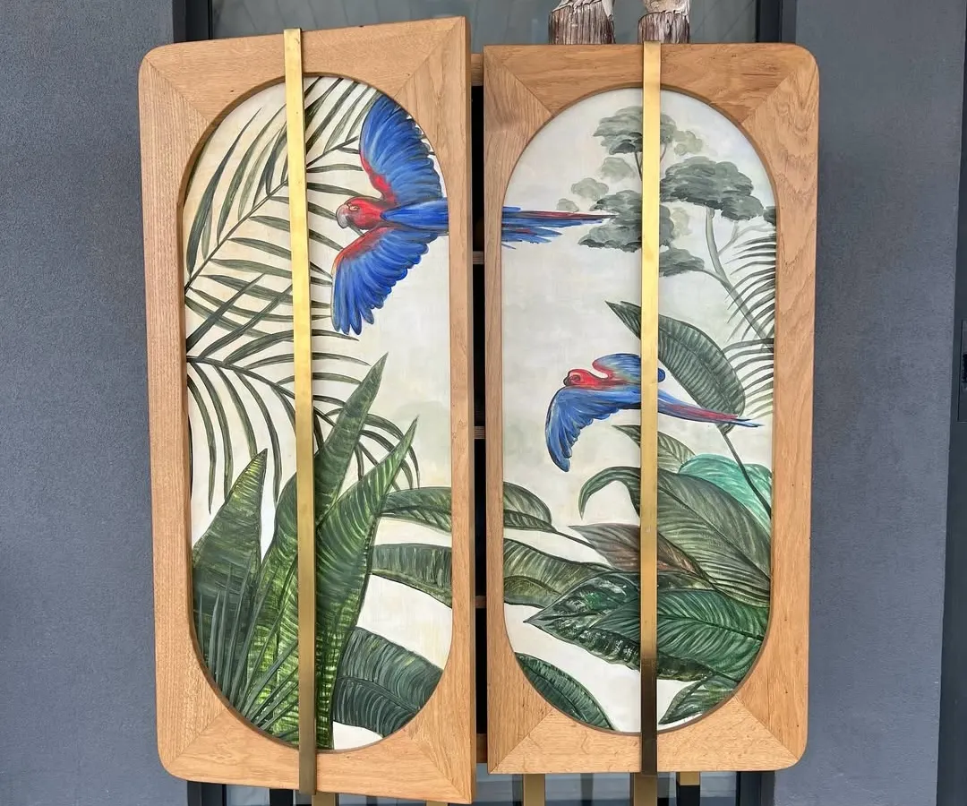 We believe a bar cabinet should be a conversation starter. This custom piece features hand-painted macaw art by Sachin Samson, framed in solid wood with elegant brass accents. It is designed not just to store spirits, but to elevate the entire ritual of hosting.