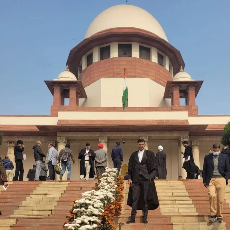 We represent clients at the highest level, including appearances at the Supreme Court of India. This image, taken on the steps of the nation's apex court, reflects our commitment to handling significant legal challenges and appeals.
