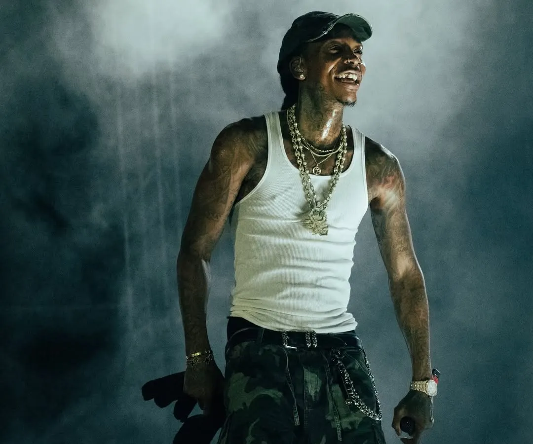 Wiz Khalifa smiles, lost in the moment amidst a cloud of atmospheric smoke at Rolling Loud India. This is the kind of candid shot I live for, capturing the genuine connection between an artist and their music.