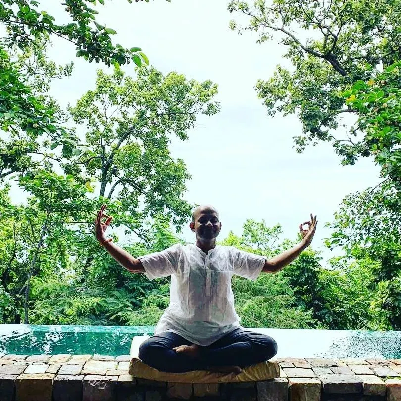 Here I am in a moment of quiet reflection in the Himalayas, practicing Jnana Mudra to open myself to knowledge and inner peace. I believe the environment we practice in becomes part of the practice itself, and the energy of these mountains is profoundly clarifying.