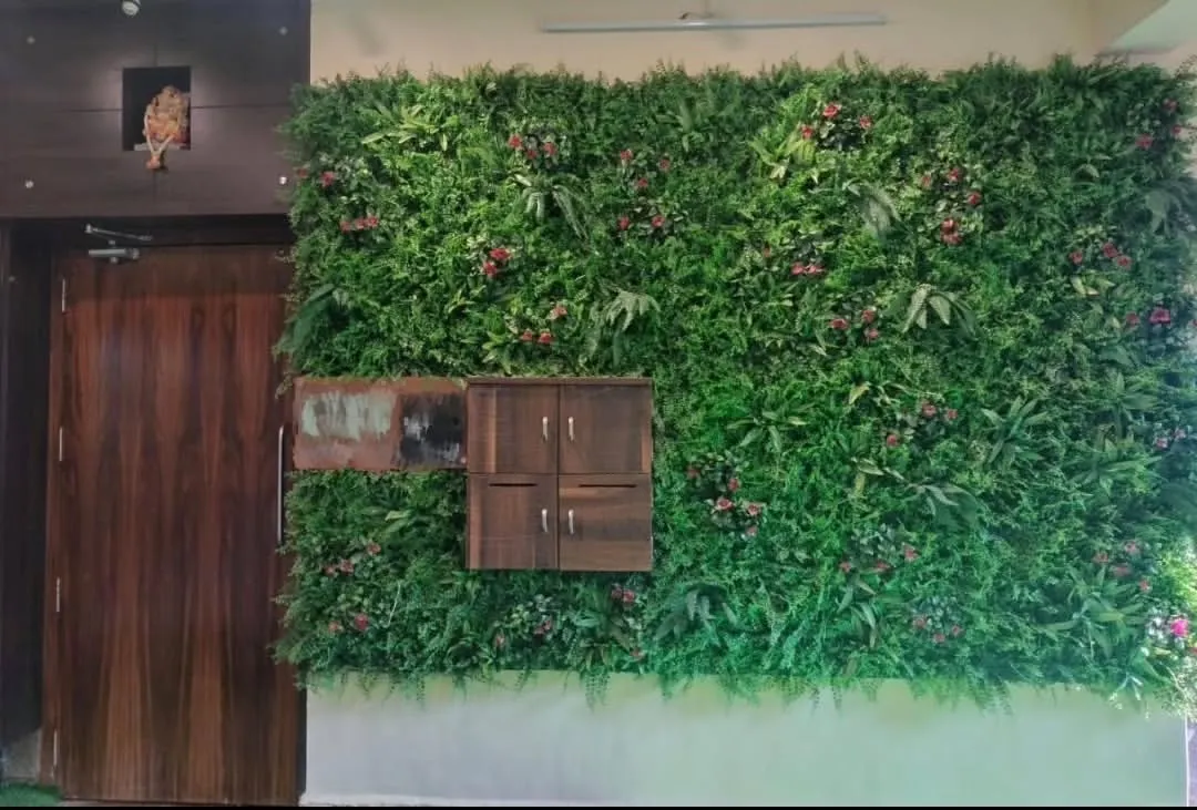 A completed artificial green wall installation for a bungalow porch. This premium, dense foliage wall creates a stunning maintenance-free entrance and integrates seamlessly with the home's architecture, including a custom cutout for the letterbox.