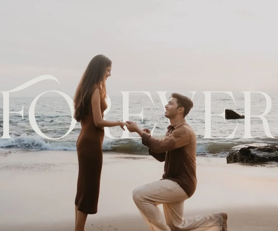 A classic beach proposal against the backdrop of a setting sun and gentle waves. We work with you to find the perfect location and time, using natural light to create a timeless and romantic portrait of your 'yes' moment. This is a perfect example of a scenic destination proposal.