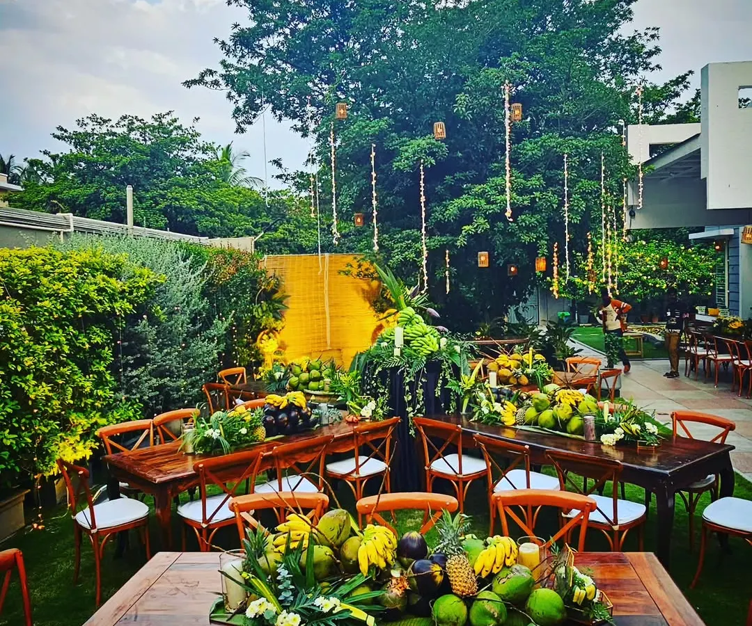 For this backyard dinner, I designed a zero-waste, farm-to-table concept. The decor is composed entirely of fresh fruits, vegetables, and foliage sourced directly from the host's farm, creating a rustic yet elegant setting that is both beautiful and sustainable.