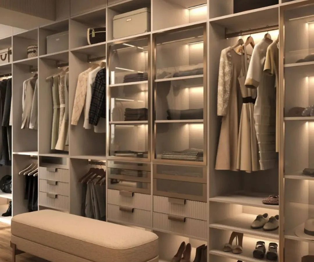 An expansive walk-in wardrobe designed for ultimate organization and elegance. This closet features custom sections for hanging clothes, glass-front drawers for accessories, dedicated shoe shelves, and integrated LED lighting throughout to illuminate your collection.