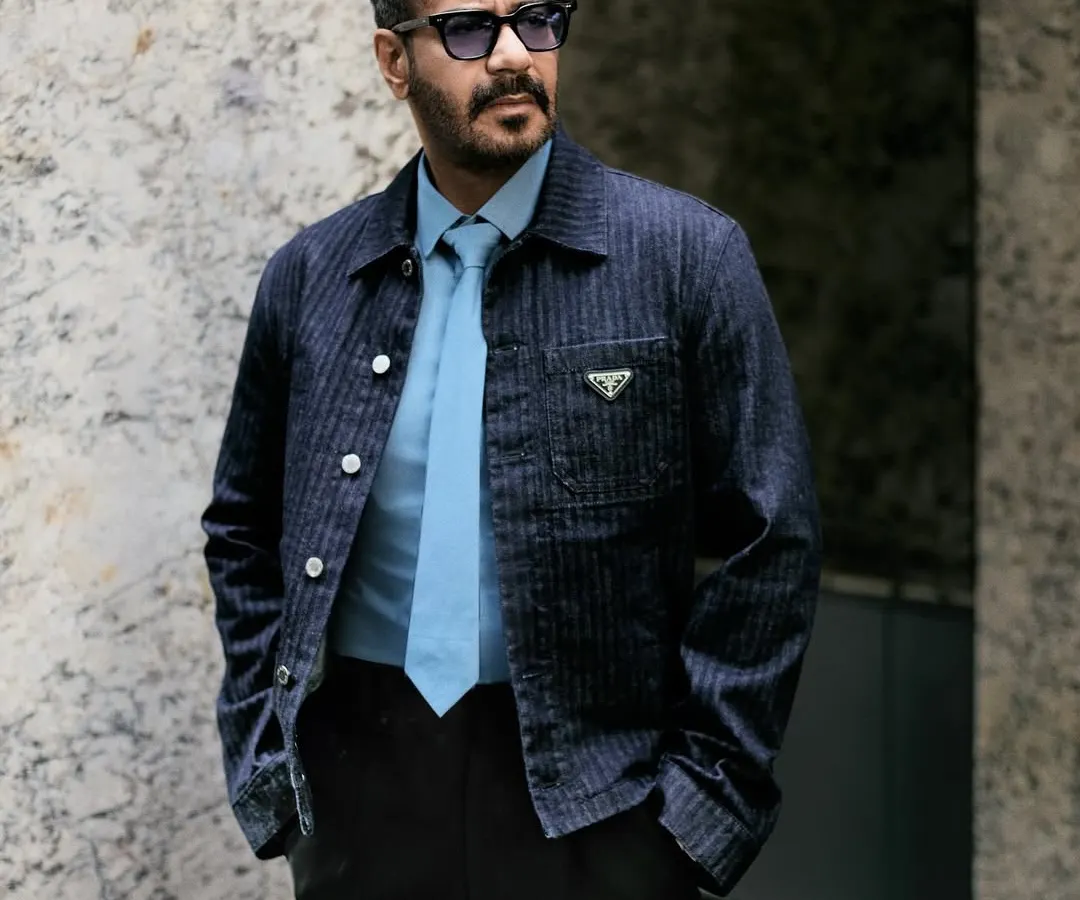 This look for Ajay Devgn at the 'Son of Sardaar 2' trailer launch features a structured Prada denim jacket and a sharp tie, creating a modern and sophisticated statement in menswear.