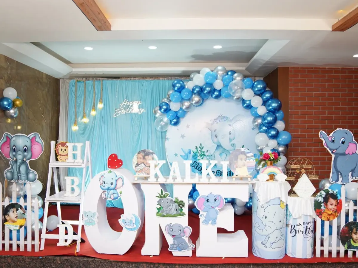 We bring your child's favorite themes to life with meticulous detail. This elephant-themed first birthday party includes a custom backdrop, large character cutouts, personalized "ONE" lettering, and a coordinated balloon arch for a picture-perfect celebration.