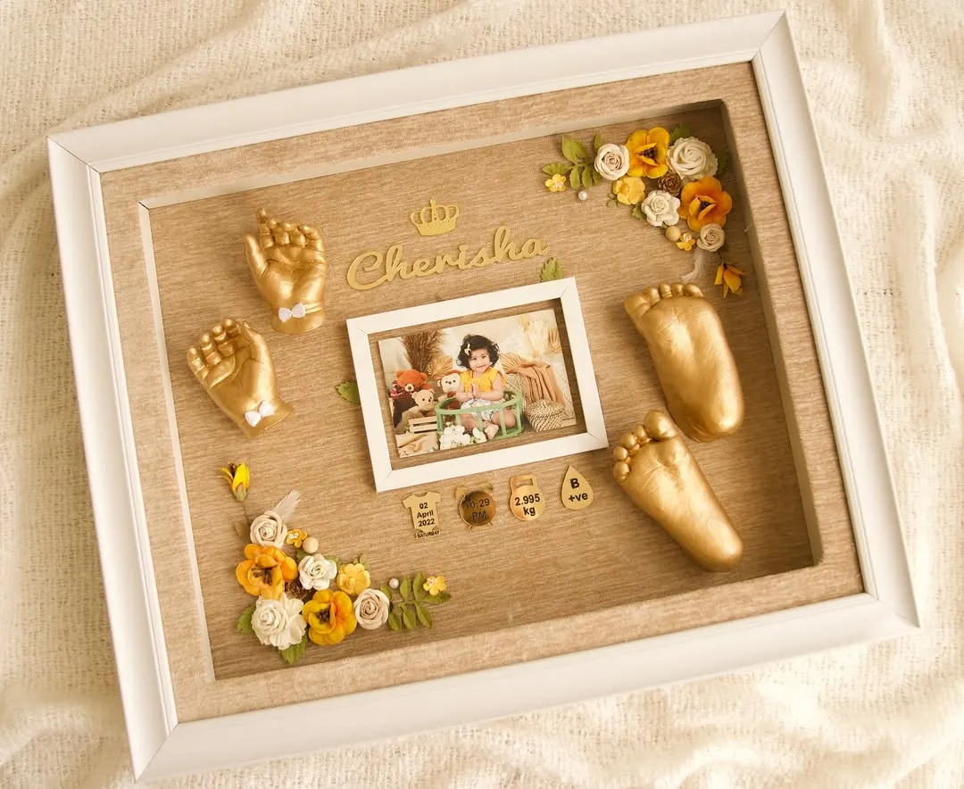 Here is a beautiful example of what you can create. This custom frame features golden hand and foot casts, a baby photo, and personalized details like the name and birth stats. I teach you how to arrange these elements to create a balanced and sentimental keepsake.