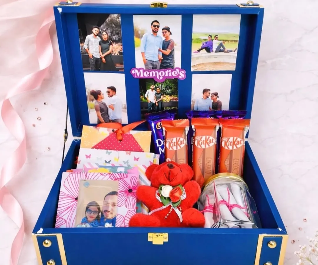 I love putting together these memory trunk hampers. This one, in a beautiful royal blue, has a photo collage inside the lid and is filled with chocolates, a teddy bear, and other little surprises you can customize.