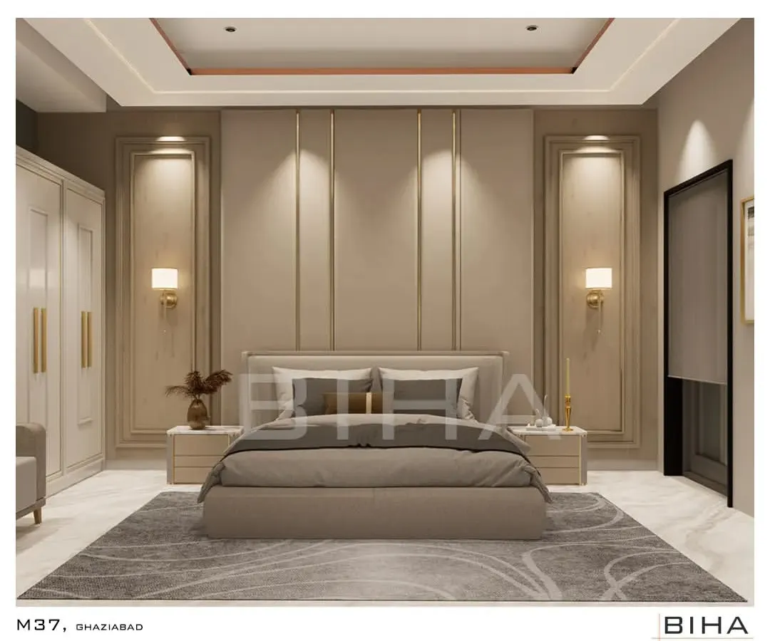 We designed this master bedroom in Ghaziabad as a sanctuary of minimalist elegance. The design centers on a symmetrical, floor-to-ceiling upholstered back panel with integrated brass accents and soft wall sconces. The recessed cove lighting in the ceiling casts a gentle glow, enhancing the serene and calming color palette.