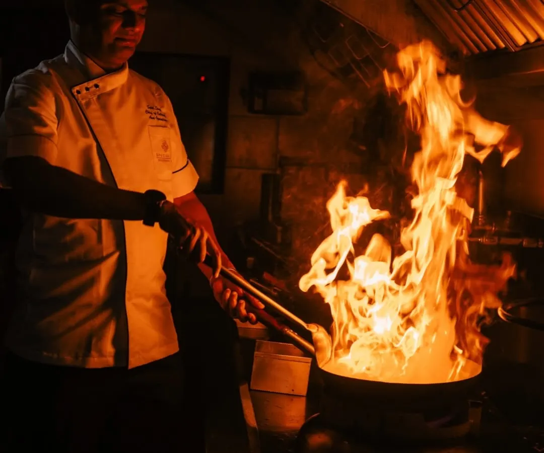 Fueled by fire, finished with finesse. A glimpse into our kitchen where the real magic happens, as our chef brings a dish to life with the dramatic flare of a wok. This is the passion and energy we bring to every event.