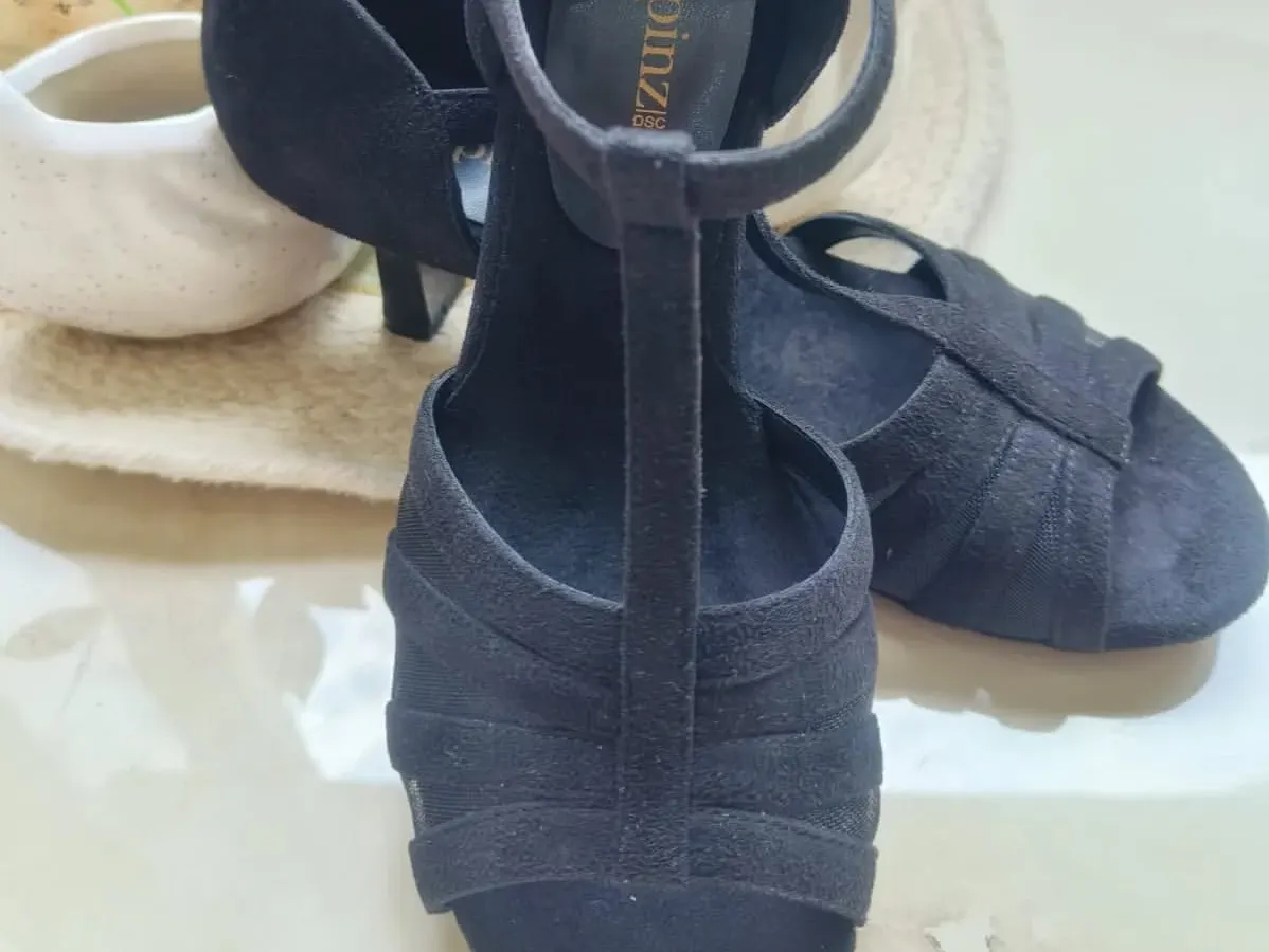Here is a detailed look at our Classic Black suede heel. We focused on a design that offers both style and function, with a secure T-strap that keeps your foot in place during every step, spin, and turn on the dance floor.