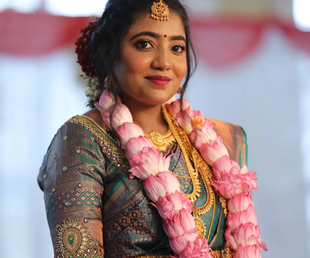 A classic South Indian Muhurtham look for this beautiful bride. I created a flawless, long-lasting base to complement her silk saree and temple jewellery, ensuring she glowed through all the ceremonies of her big day.