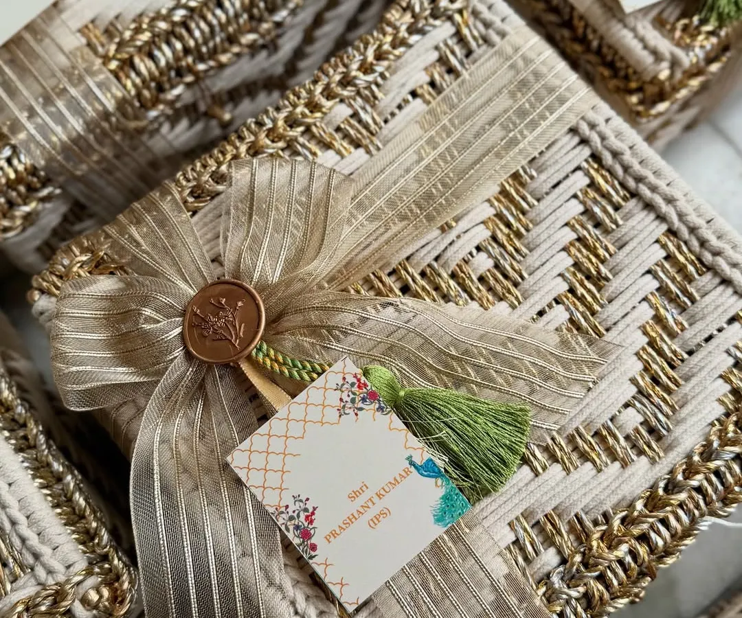 It was an honor to design these engagement invitation hampers for cricketer Rinku Singh and MP Priya Saroj. Each bespoke woven box was finished with a personalized gift tag and our signature wax seal, reflecting the opulence and importance of this special union.