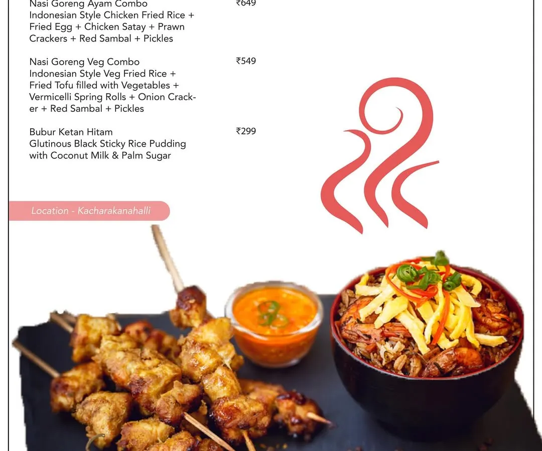 Explore the vibrant flavours of Southeast Asia with our home-cooked Indonesian meals. This platter features authentic Nasi Goreng, chicken satay with a rich peanut sauce, and a refreshing side of pickles, offering a complete gourmet experience.