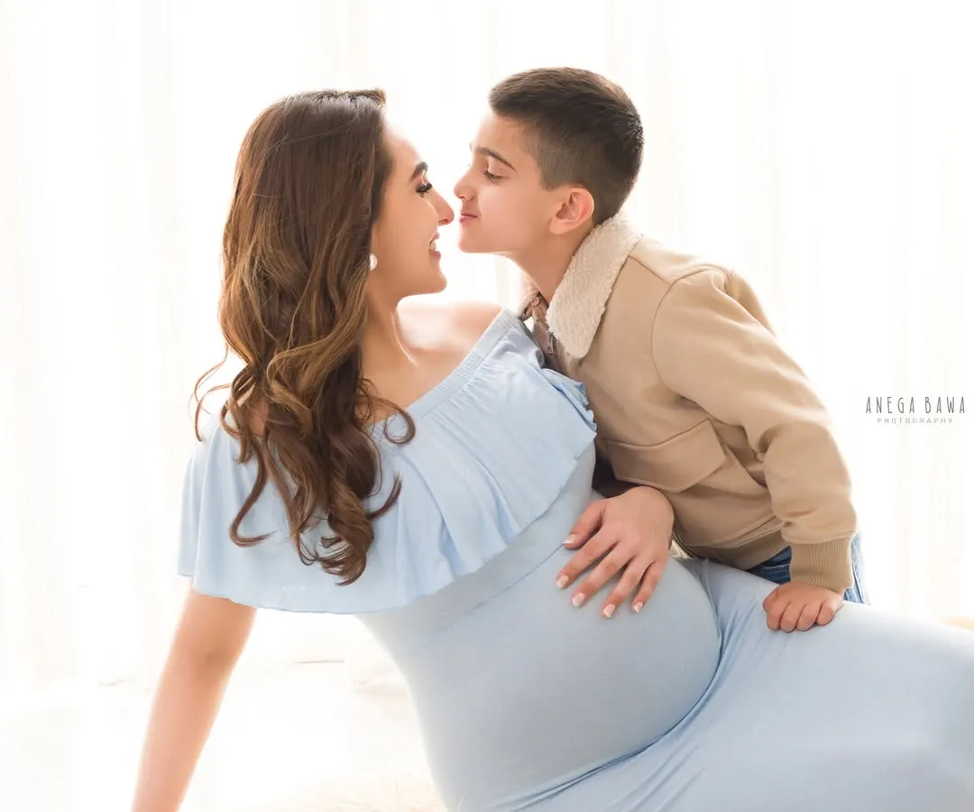 The whispers between a mother and her firstborn before a new life arrives are so precious. I use soft, natural light to capture these gentle, unscripted moments of love that become timeless family heirlooms.