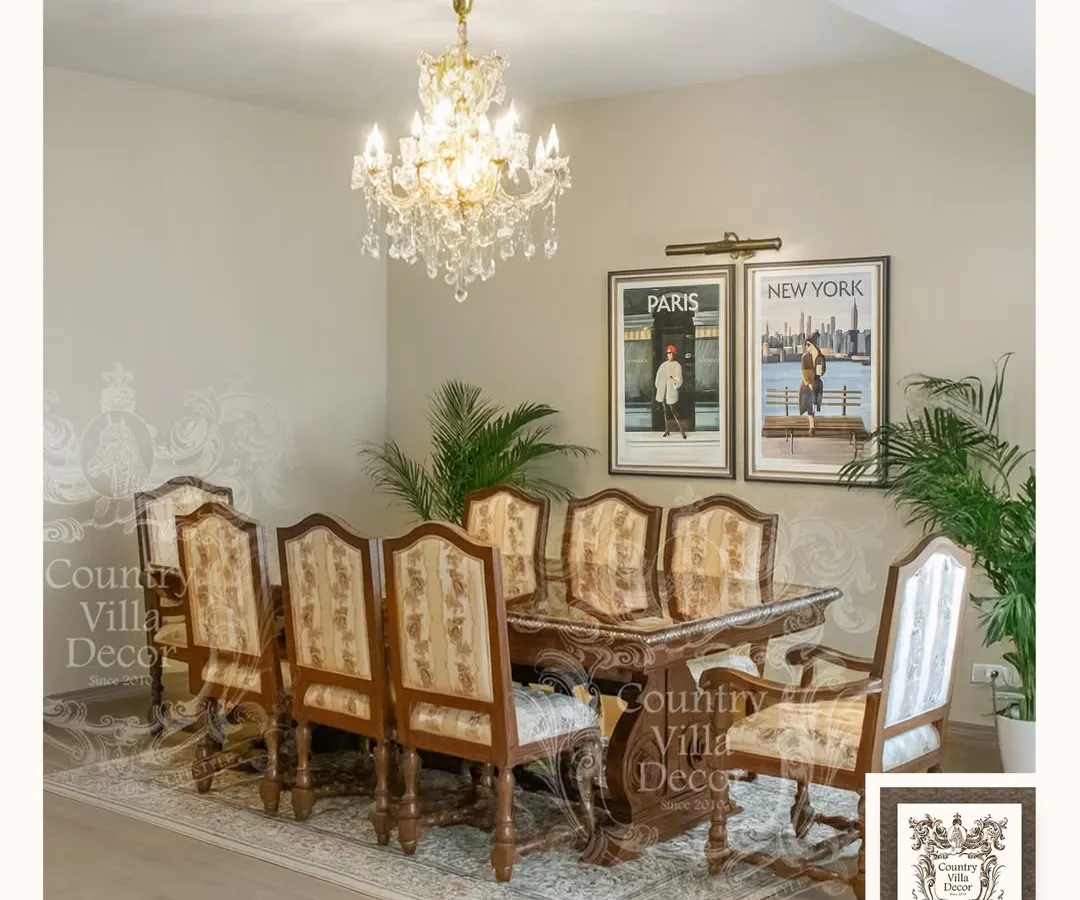 A statement crystal chandelier transforms this dining room into a space for memorable gatherings. Its warm, radiant light enhances the rich wood of the dining set, creating an atmosphere of sophisticated elegance perfect for any occasion.