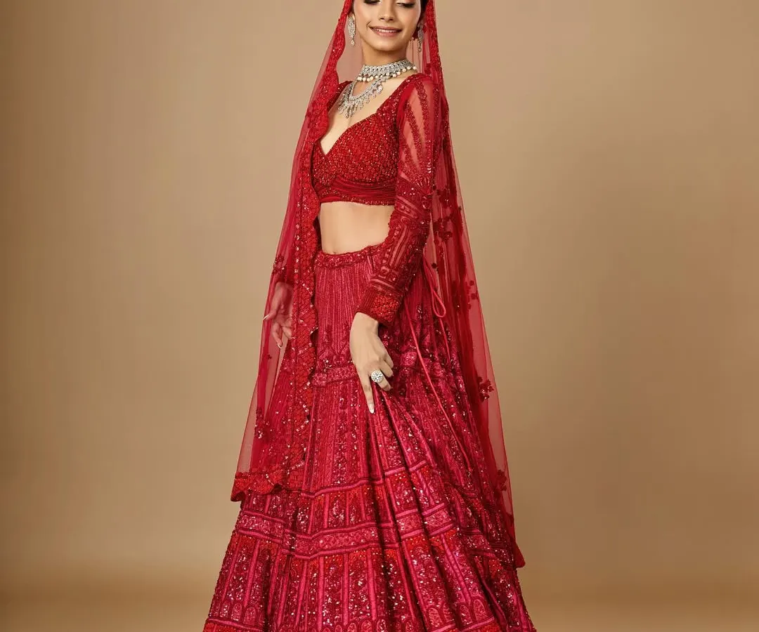A classic red bridal look is timeless for a reason. Here, I’ve balanced the richly detailed lehenga with radiant skin and defined eyes, creating a look that is both traditional and breathtakingly beautiful for the main wedding day.