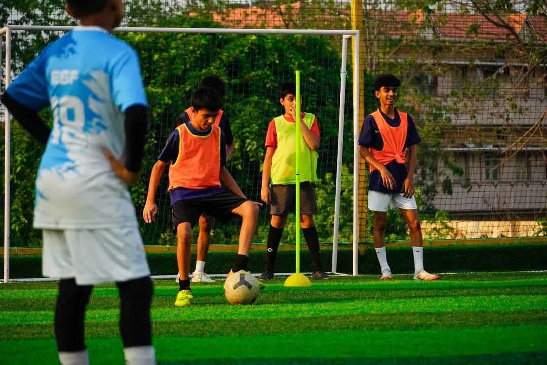 Here, we focus on the fundamentals. This training session shows our young players working on close ball control and dribbling around markers, a key drill to improve their first touch and confidence on the ball.
