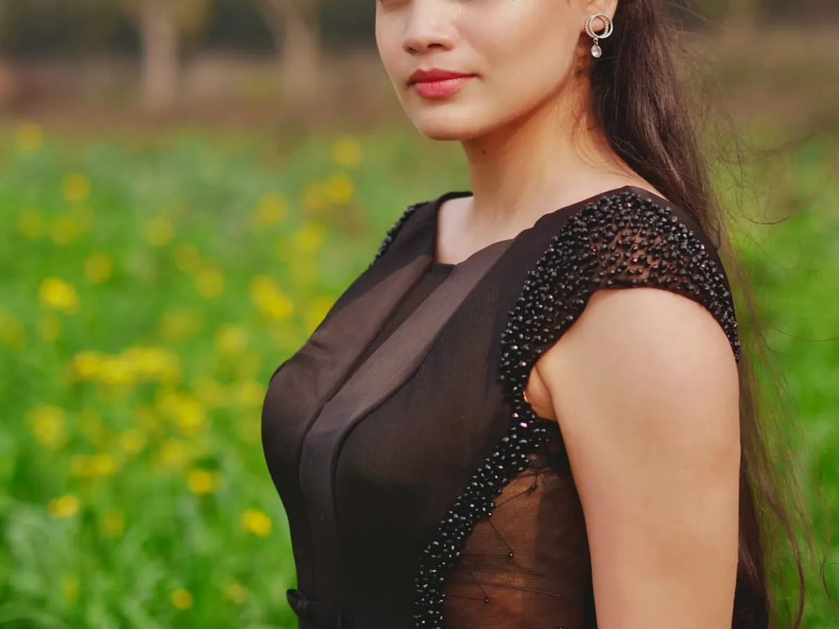 My ready-to-wear formal collection includes elegant pieces like this black evening gown. Notice the intricate beading on the cap sleeves and the sheer paneling on the bodice, details designed to create a sophisticated and glamorous silhouette for any formal event.
