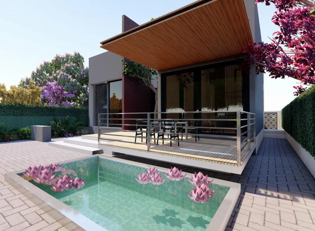 This view highlights the integration of leisure elements into the landscape design. The custom wooden deck provides a functional outdoor seating area, complemented by a serene water feature with aquatic plants, creating a private oasis.
