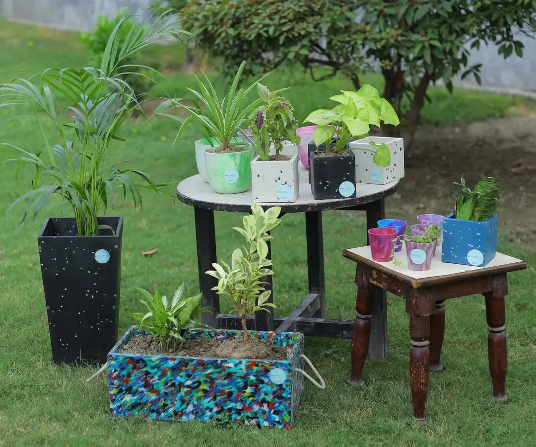 This is what sustainability looks like in your garden. Our collection of recycled plastic planters, from large statement pieces to small pots, brings unique color and character to any green space, all while keeping plastic out of landfills.