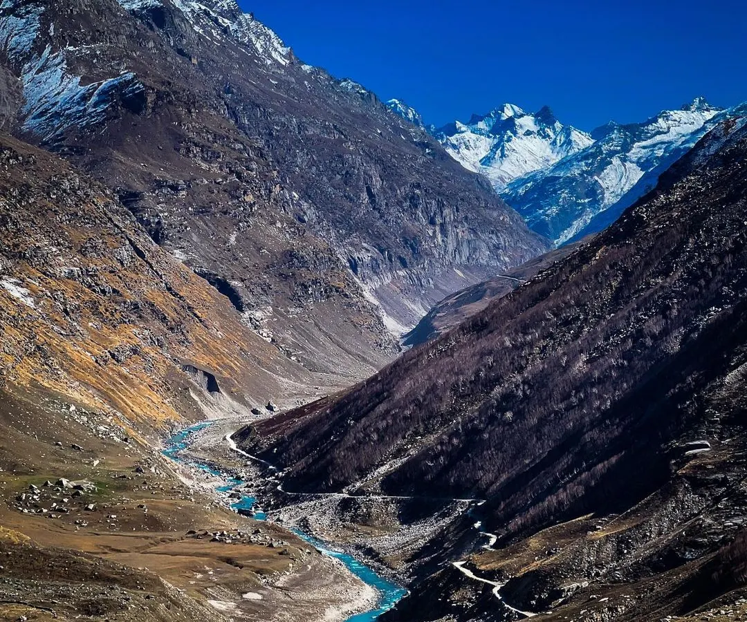 The raw, untamed beauty of Spiti Valley. I used my iPhone for this shot to capture the dramatic contrast between the bright blue river carving its path through the cold, desolate mountain landscape.