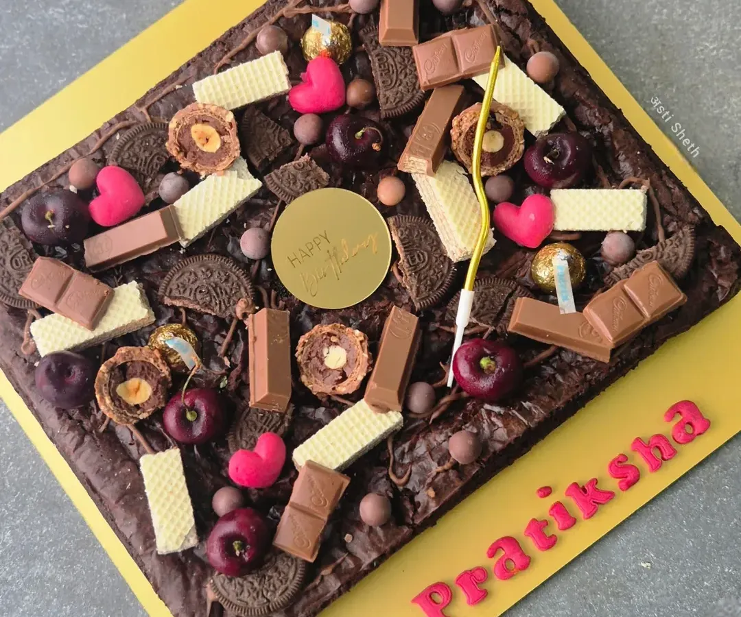 My fudgy and gooey brownie slab is a dream for any chocolate lover. Made with rich coverture chocolate, this egg-free brownie has a perfect crinkled top and can be customized with various toppings for birthdays and celebrations.