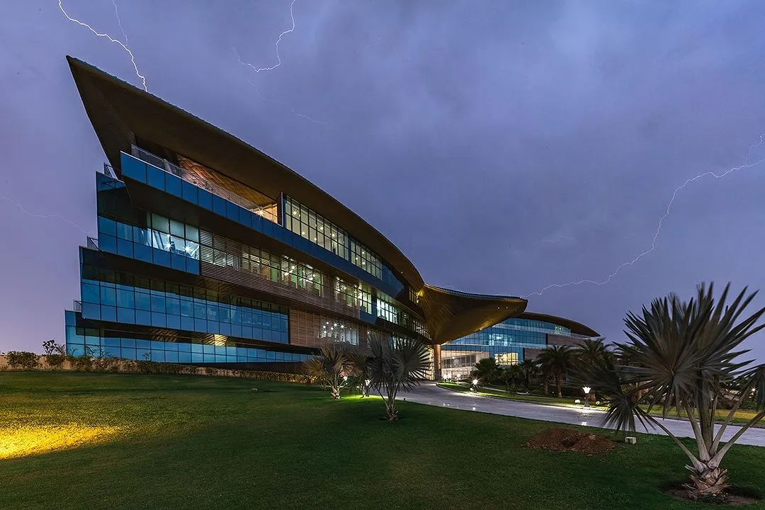 The Jaquar Global Headquarters captured against a dramatic sky. This project showcases our ability to create dynamic, large-scale commercial architecture that is both a landmark structure and an energy-efficient, net-zero building.